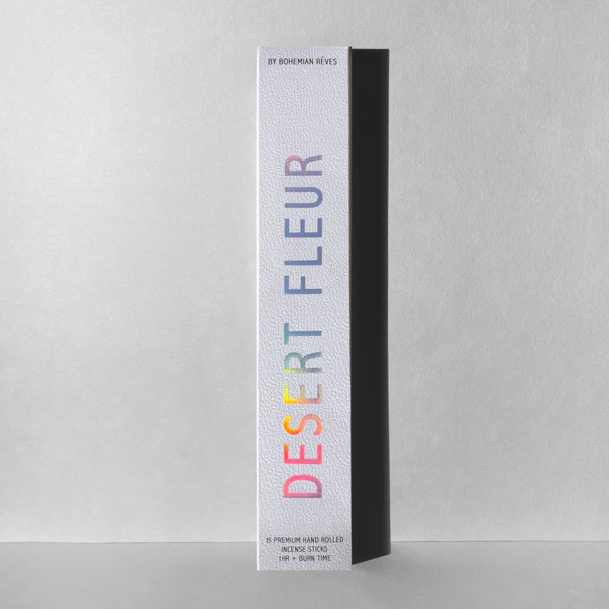 Desert Fleur incense packaged in a white box with iridescent letters.
