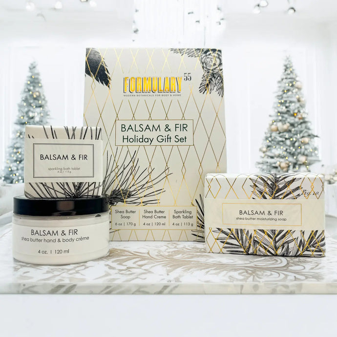 Balsam & Fir holiday gift set with soap, cream, and packaging on a white background.