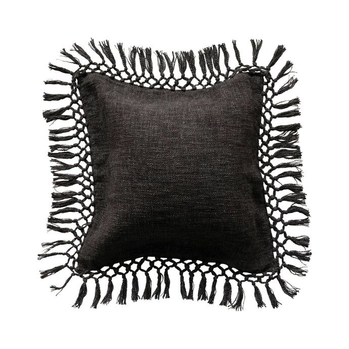 Black pillow with tassels on a white background