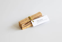 Load image into Gallery viewer, Palo Santo sticks tied with a string on a white background
