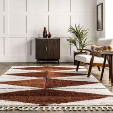 Load image into Gallery viewer, Living room with a patterned rug, wooden cabinet, and armchair.
