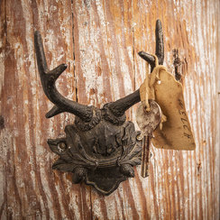 Load image into Gallery viewer, Decorative antler wall hook with a tag on a wooden background
