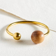 Load image into Gallery viewer, Gold and wooden bracelet on a white background
