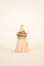 Load image into Gallery viewer, pave gold ring stack on wood display

