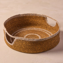 Load image into Gallery viewer, Woven basket with circular patterns on a beige background
