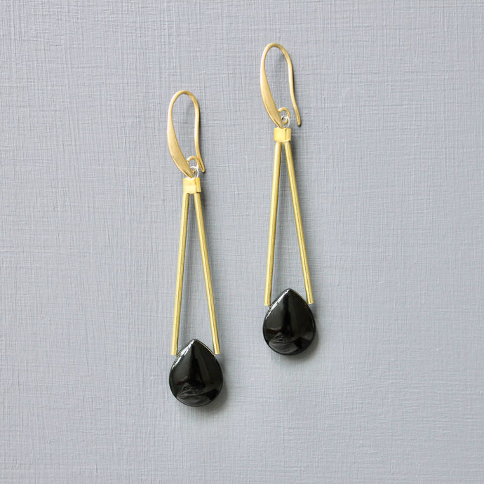 Gold plated earrings with black teardrop-shaped drops