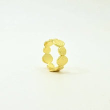 Load image into Gallery viewer, Gold ring with a textured design on a light beige background
