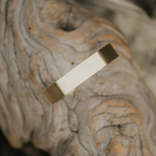 Load image into Gallery viewer, Gold braclet on a textured stone surface
