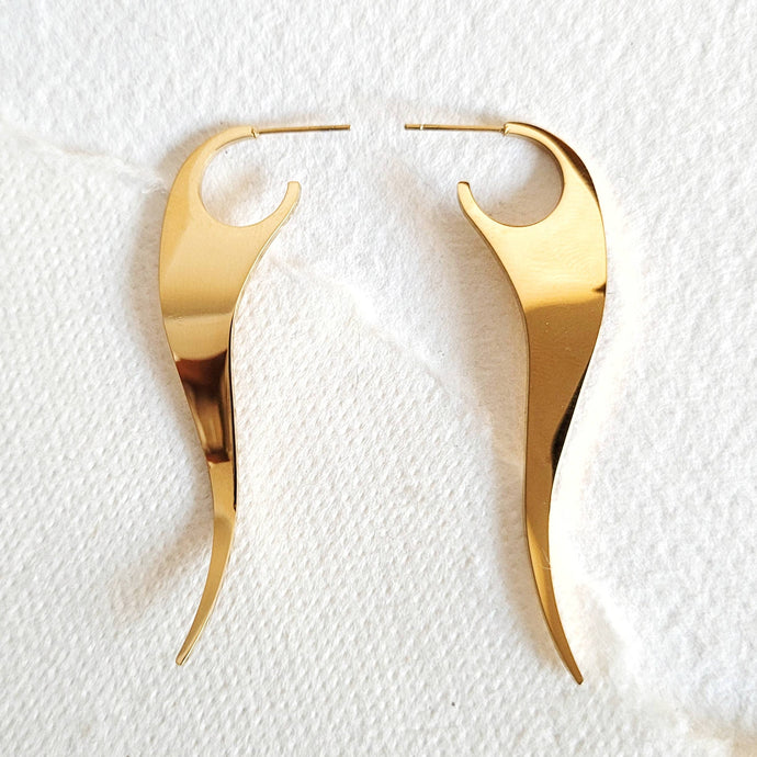 Bisjoux - 18k gold plated hoop drop Earrings modern high quality  earrings on a textured white background
