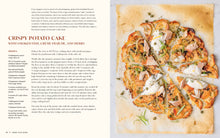 Load image into Gallery viewer, Crispy potato cake with smoked fish, crème fraçèche, and herbs on a white plate.
