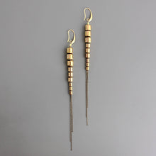 Load image into Gallery viewer, Gold brass beaded chain earrings on a gray background
