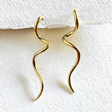 Load image into Gallery viewer, Gold wavy hoop earrings on a white background
