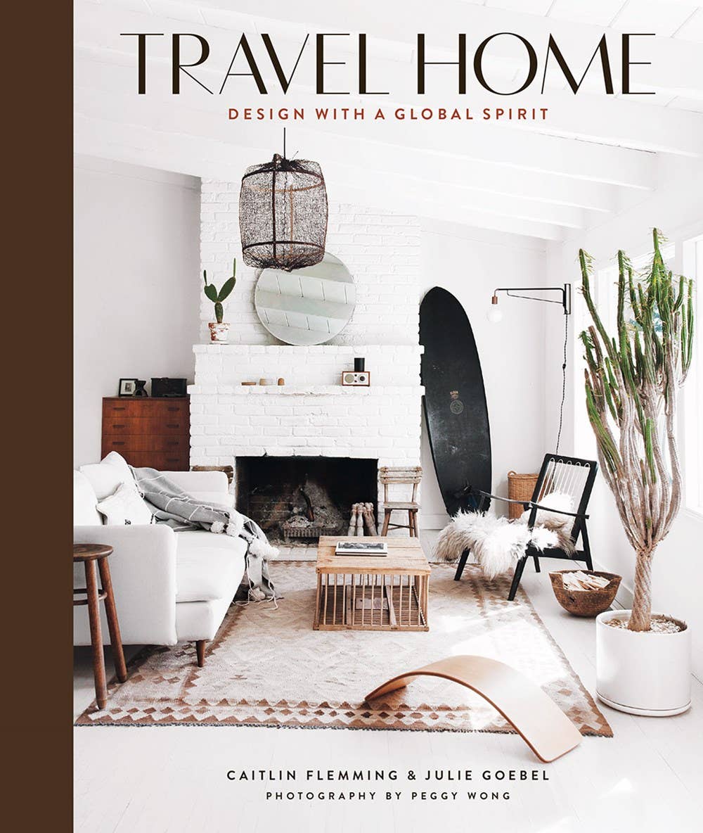 Book cover of 'Travel Home' with a modern living room interior design.