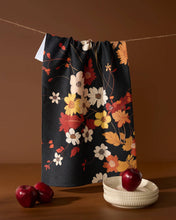 Load image into Gallery viewer, Floral-patterned bag on a string with apples and a bowl on a brown background
