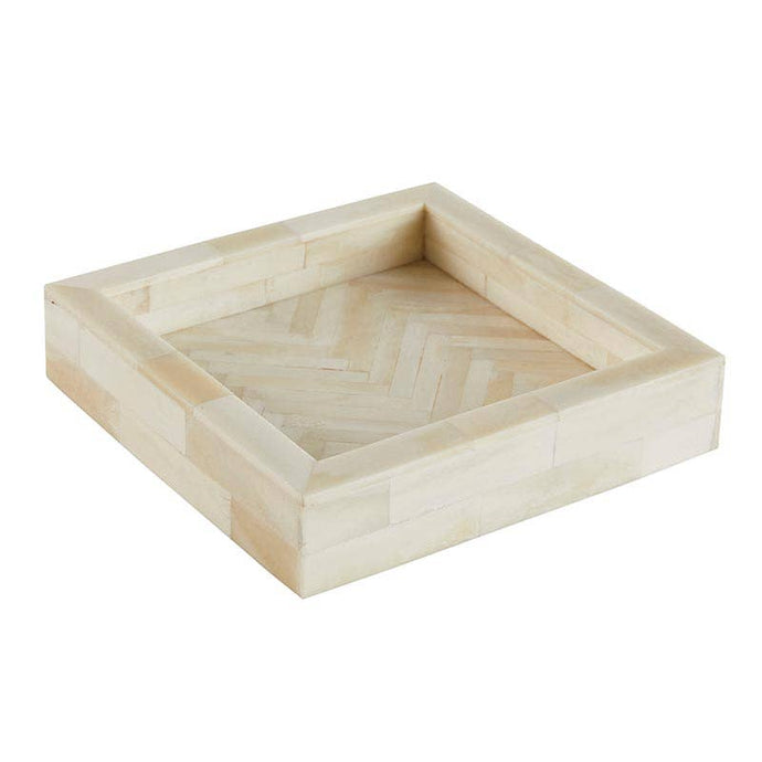 Bone square shaped tray with a herringbone pattern on a white background