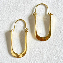 Load image into Gallery viewer, Gold hoop earrings on a white background

