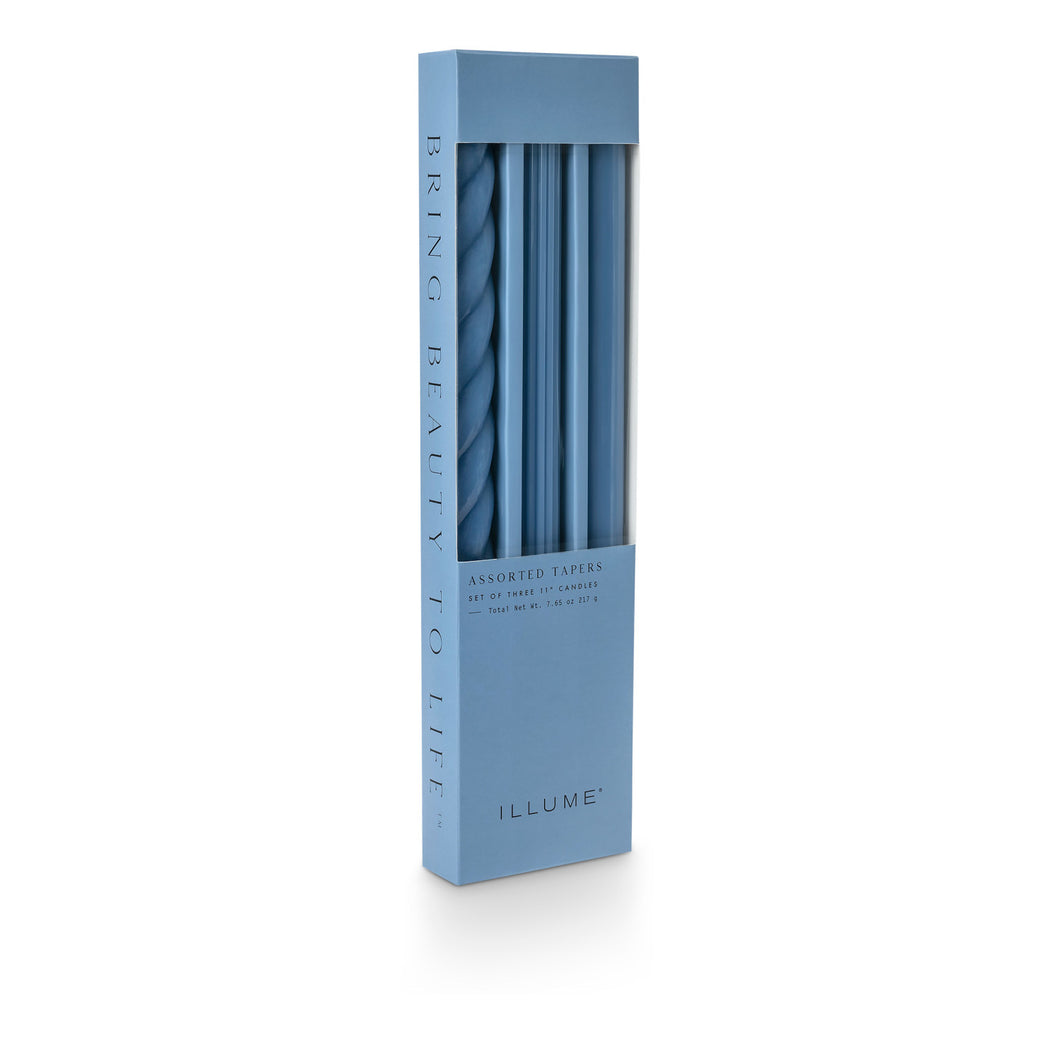 3 tapered candles each with a different texture including a twist, fluted and smooth in Sky blue
