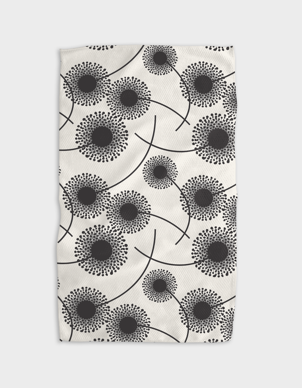 A white tea towel with a black floral pattern, featuring a single-sided print and a hang loop.